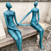 Bronzefiguren Sitzendes Paar