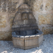 Wandbrunnen mit Mascaron